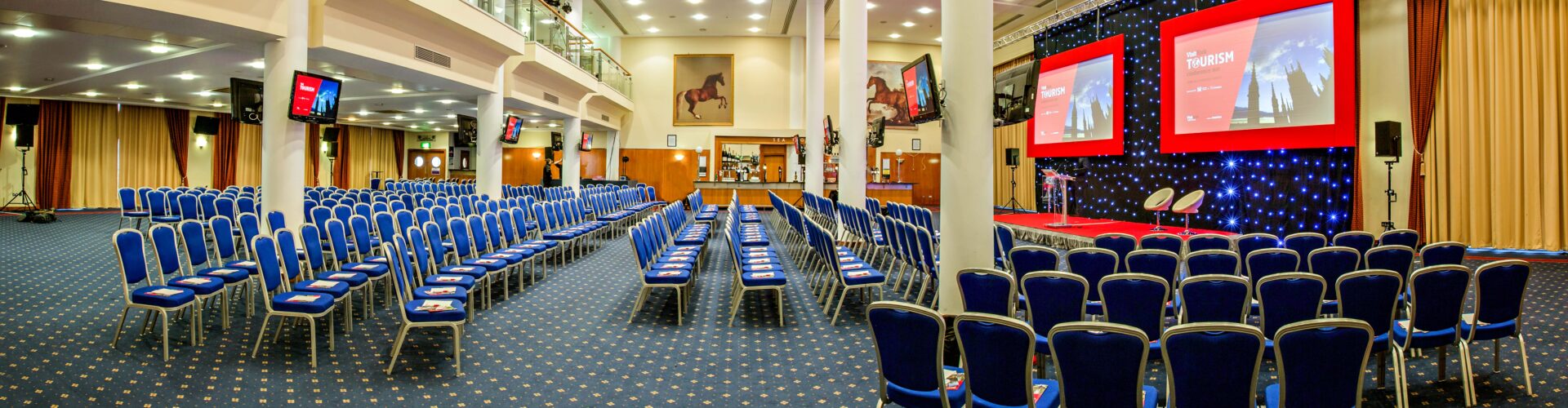 conference chairs and stage at York Racecourse