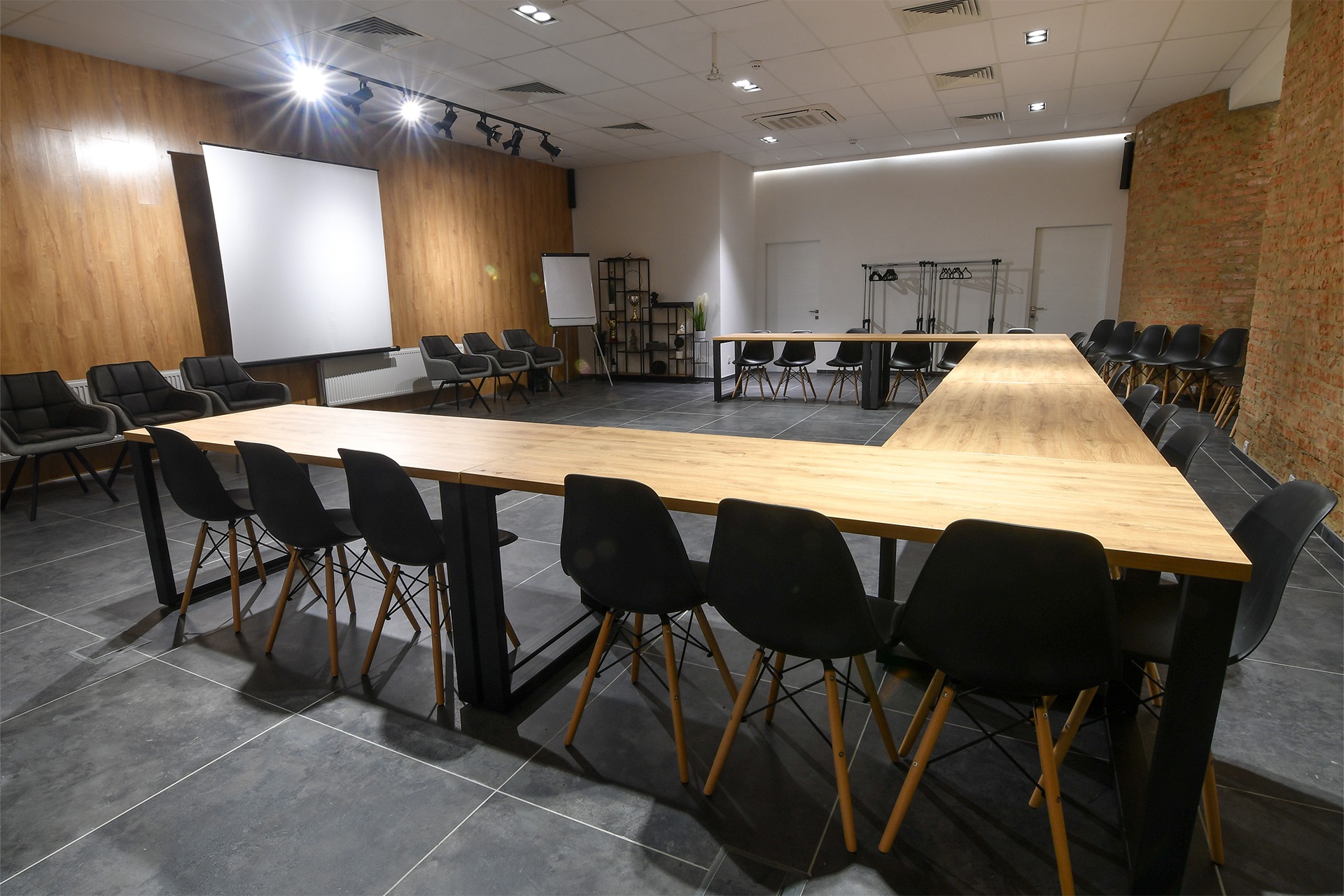 a small empty conference room with a U-shaped configuration